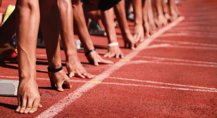 Cropped image of a sprinter getting ready to start at the stadium