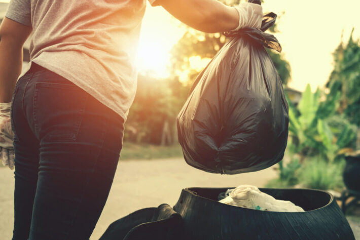 woman hand holding garbage bag for recycle cleaning